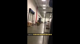 Man driving forklift has too much to handle