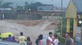 Road turns into raging river during floods in Philippines