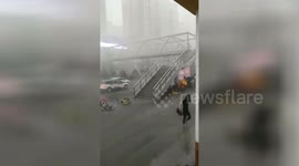 Woman blown down flight of overpass steps during powerful windstorm