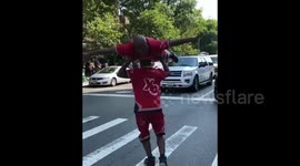 Man spins on twin brother's head in amazing workout stunt