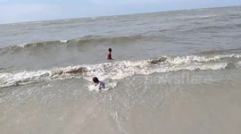 Kids playing on the beach in Indonesia