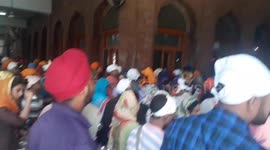 Big line of Indians waiting to get free food in a Temple