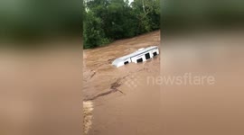 Camper van floats down overflowed Fishing Creek
