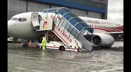 Planes submerged in floodwaters after torrential rain