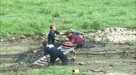 Firefighters rescue man and his parrot who had sunken into mud like ‘quicksand’