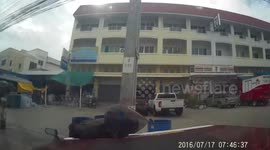 Family's car clipped by oncoming bus and spins into motorcycle rider