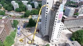 Tallest excavator in the UK does building repairs 70m above ground