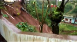 Three-story house glides down a hill after landslide