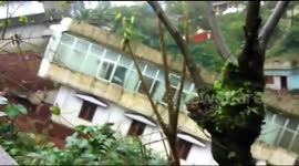 Moment three-storey home slides down hill after heavy rain in southwest India