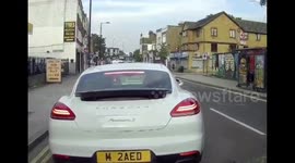 Caught on dash cam, driver in a Porsche robbed at knife point by idiots on mopeds, London.