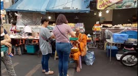 Religious harmony - Muslim Women Selling Buddha Tribute Items for monk Offerings