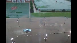 Pickup truck drives through deep floodwaters on OSU campus