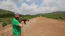 Tourists Shoots a AK47 In Cambodia with the military