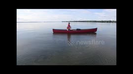 Canoeist captures amazing drone footage from canoe in middle of lake