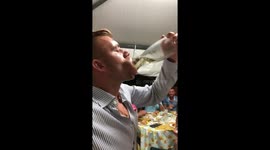 Italian man downs a whole carafe of wine in one go