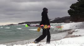 Skier walks alongside Lake Michigan
