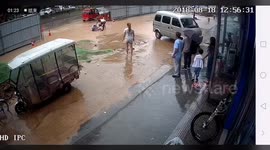 Two girls fall into pit covered by floodwater