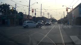 Motorcyclist tumbles into the air after head-on collision with car