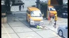 Mad woman throws herself in front of moving van after failing to get son run down