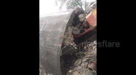 Water tank collapses and crushes digger in demolition fail
