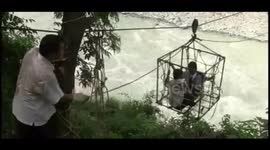 Children risk their lives using trolley 100 feet over river to reach school