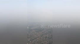 View from flight into Seattle shows city smothered in wildfire smoke