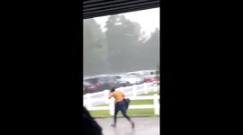 Girl yanks off new wig in heavy downpour before making hilarious dash for car