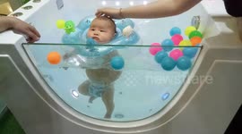 This baby knows to pamper himself at baby spa