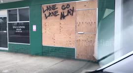 Honolulu resident leaves message for Hurricane Lane on boarded-up storefront