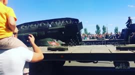 Russian tank embarrassingly barrel rolls off trailer during parade