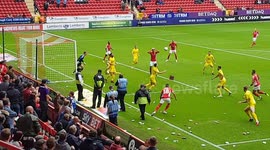 Charlton fans throw crisp packets onto pitch in protest