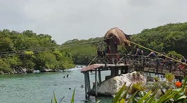 Dad and Lad Zip-Lining at Xel-Ha.  Dad burns head on wire and Lad gets stuck.  Funny fail