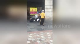 Elderly woman shows she loves to boogie in Glasgow street