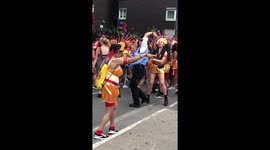 Dancing police officer takes a twirl at the Notting Hill Carnival