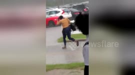 Girl yanks off new wig in heavy downpour before making hilarious dash for car
