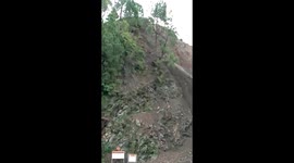 Landslide crushes truck like cardboard box on highway