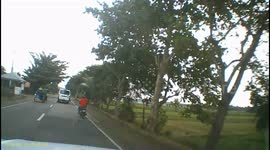 Motorcyclist goes head over handlebars after crashing into the back of minivan