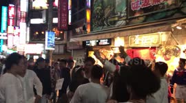 Yakuza teenagers having fun with random girls during Halloween in Tokyo.