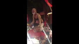 The funny fan of Vietnam football team wearing a bra dancing on the street