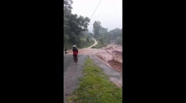 Flash floods turn road into a river in northwest Vietnam