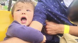 Two-year-old boy reacts badly to first-ever fairground ride