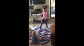 Adorable baby loves watching her sister dance