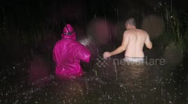 Crazy footage shows residents walking home in waist-deep water as Hurricane Lane nears