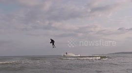 Man glides over seafront like Iron Man with hi-tech jetpack
