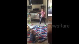 Adorable baby loves watching sister dance
