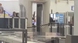 Man tries to bring    Handgun through  TSA  lax airport police called  to make the arrest