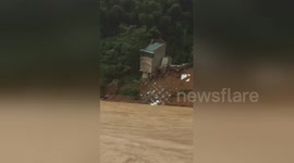 Moment home in Vietnam is swept away amid heavy landslides