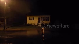 Man takes shower during severe storm