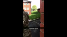 Soldier sticks dildo on a window