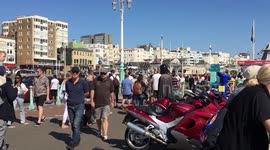 Summer’s back! Hordes gather on Brighton beach